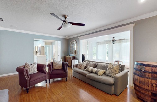 Spring Hill House | Bright & charming beach retreat with large lanai, firepit, & fireplace - dogs ok