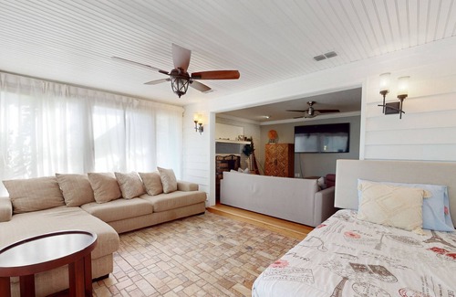 Spring Hill House | Bright & charming beach retreat with large lanai, firepit, & fireplace - dogs ok