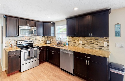 Pinellas Park House | Bright Home with Private Pool, High-Speed WiFi, Firepit, Outdoor Bar, and Grill