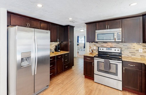 Pinellas Park House | Bright Home with Private Pool, High-Speed WiFi, Firepit, Outdoor Bar, and Grill