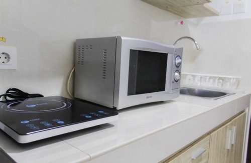 Panunggangan Utara Apartment | Bright Studio Apartment at Springwood Residence