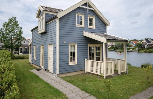 Municipality of Nissewaard House | Bungalow by Water near Rotterdam with Sauna