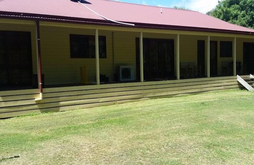 Buxton House | Buxton Gardens by the RivernCountry style home, river flowing thru the backyard