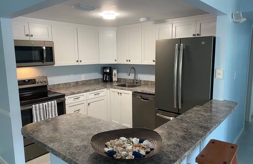 Marathon Condo | BYOB -boat-Completely renovated, private ramp, boat slip, heated pool and more!