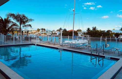 Marathon Condo | BYOB -boat-Completely renovated, private ramp, boat slip, heated pool and more!