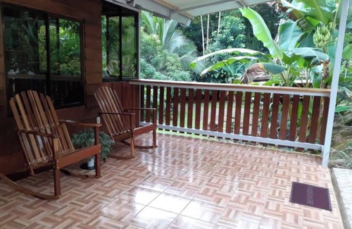 Penas Blancas Cabin | Cabin in La Fortuna with rustic finishes, river and forest