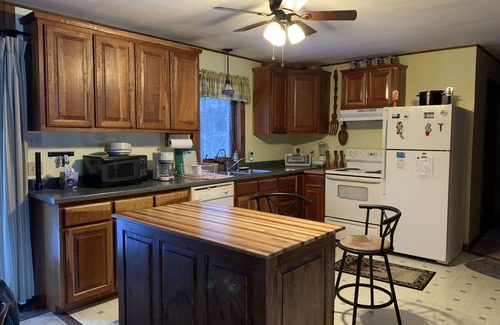 Newport Cabin | Cabin is nestled near the Sugar River in a country setting next to a open field.