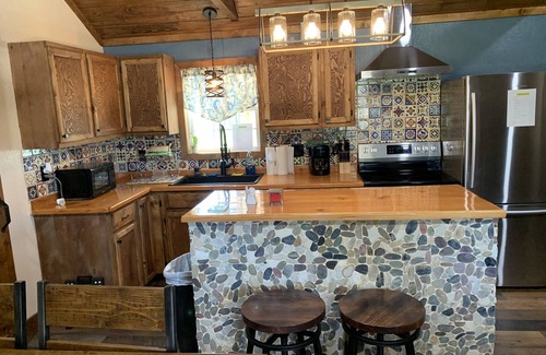 Camp Wood Cabin | Cabin with Deck . Close Nueces River