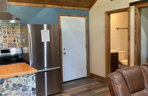 Camp Wood Cabin | Cabin with Deck . Close Nueces River