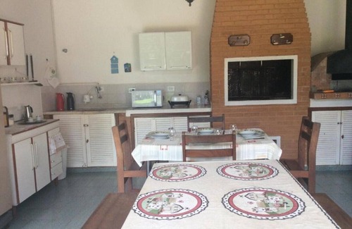 Vila Natal Ski Chalet | Campos do Jordão - Suite with living room, on the mountain overlooking the woods