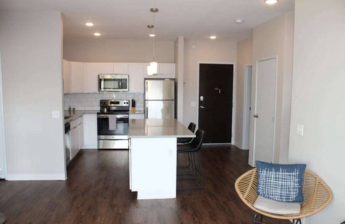 Ames Apartment | Campustown Flat near Jack Trice with Firepit