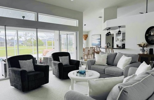 Pinehurst House | Canal Front Charm: Heated Pool, Firepit & Breathtaking Sunset Views