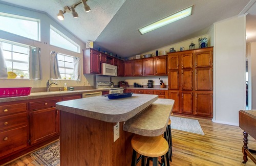 Astor House | Canal-Front Home with Private Covered Boat Dock & Waterfront Screened Porch