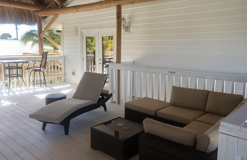 Englewood Apartment | Caribbean Tiki Hut relaxation. Enjoy the Islands & Boca Grande without the costs