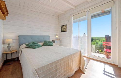 Camarles House | Casa Arbol