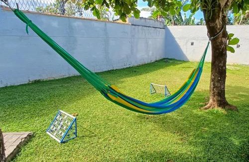 Estufa I House | Casa Temporada Ubatuba próxima à praia, check-in e out flexíveis com 5 vagas na garagem, wifi