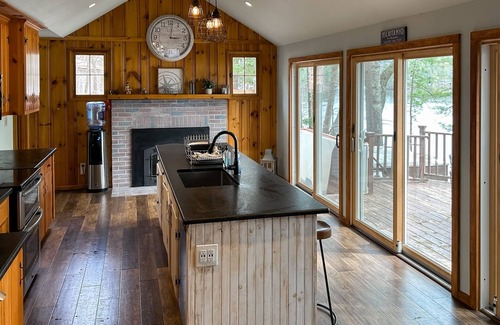 Pine River Pond House | Central lakefront house with private hot tub, dock, patio bar, & beach access