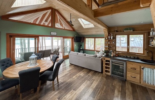 Pine River Pond House | Central lakefront house with private hot tub, dock, patio bar, & beach access