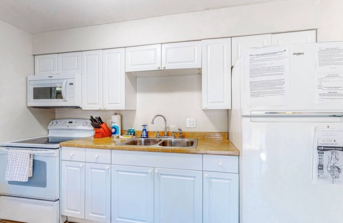 Largo Condo | Centrally located condo with heated pool, balcony, washer/dryer & central AC