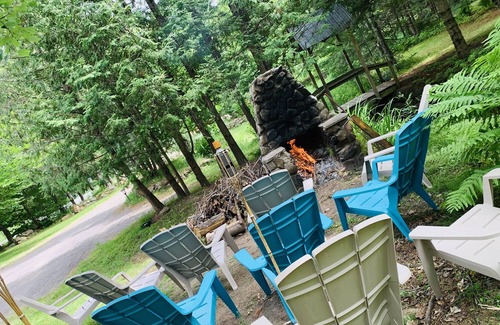 Rawdon House | Chalet du Ruisseau Rawdon hot tub outside inside fireplace for up to 16 people