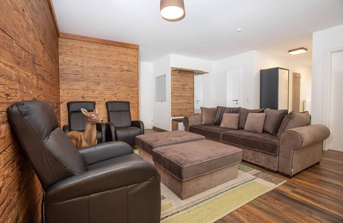 Konigsleiten Apartment | Chalet Hirsch is furnished in a rural style