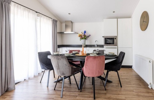 Municipality of Veldhoven Ski Chalet | Chalet in Netherlands by Scenic Pond