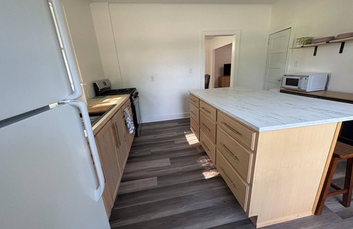 Lake Mills House | Charming 1900 home with furnished kitchen and king bed