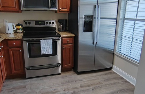 Capri Isle House | Charming 2 Bed Treasure Island Townhouse, heated community pool.