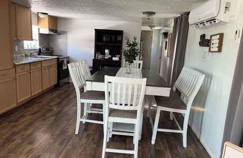 Southside Rural Community House | Charming 2-bedroom 2-full bath home with fishing dock, kayaks, WiFi, AC and more