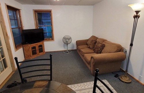 Garrison Cabin | Charming 2-bedroom cabin, offering AC and WiFi for a delightful stay.