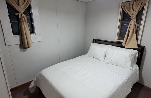 Garrison Cabin | Charming 2-bedroom cabin, offering AC and WiFi for a delightful stay.