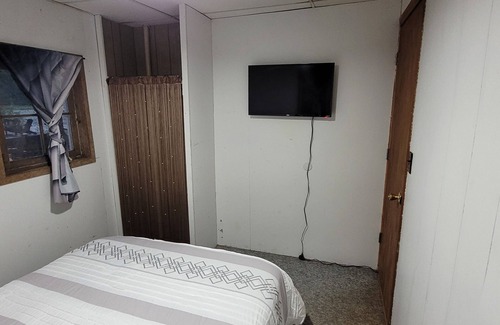 Garrison Cabin | Charming 2-bedroom cabin, offering AC and WiFi for a delightful stay.