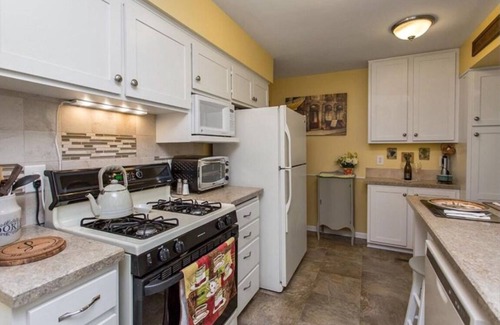 North of Grand House | Charming 4 Bedroom Home With Beautiful Backyard