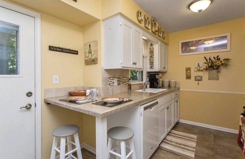 North of Grand House | Charming 4 Bedroom Home With Beautiful Backyard