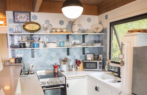 Three Tree Point House | Charming and eclectic treehouse-like home with expansive Puget Sound views