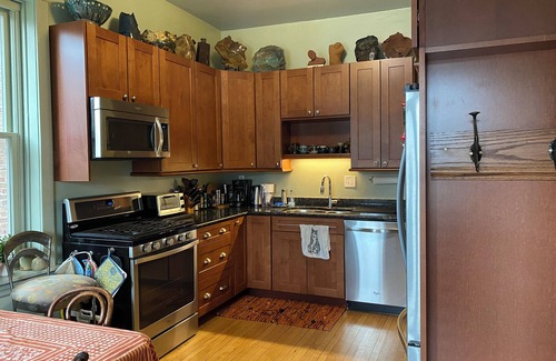 Logan Square Apartment | Charming art filled Chicago 3 bedroom in popular Logan Square. Lovely yard.