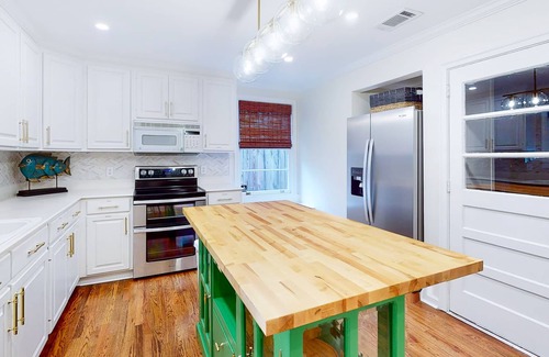 Brunswick House | Charming bungalow near historic district with fenced yard, patio, & fireplaces