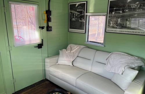 Freedom Bed & Breakfast | Charming Caboose-turned-tiny home on lake