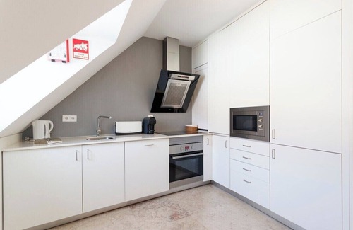 Santa Engracia Apartment | Charming Duplex with River and City Views