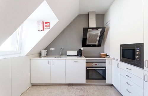 Santa Engracia Apartment | Charming Duplex with River and City Views