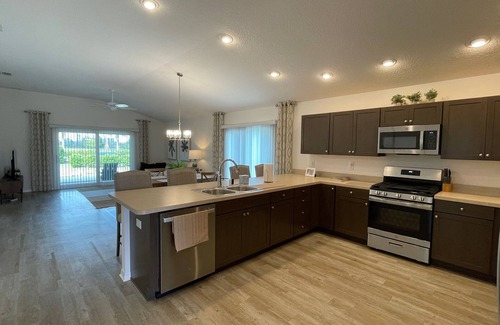 Okahumpka House | Charming home w/spacious kitchen, water view, enclosed lanai, & Pet Friendly