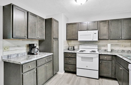 Interchange Square House | Charming home with private W/D, WiFi, and screened in porch