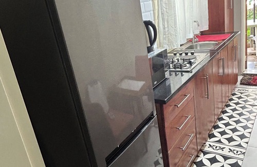 Lusaka Cottage | Charming Mango Cottage in Lusaka – Garden Views & Free WiFi