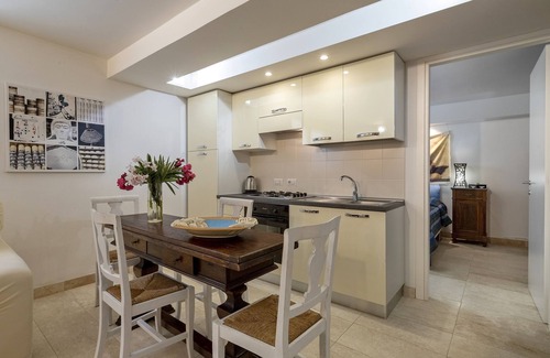 Fertilia Apartment | Charming Seafront Apartment with garden and patio