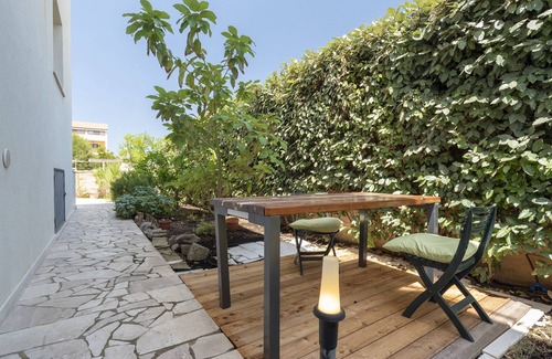 Fertilia Apartment | Charming Seafront Apartment with garden and patio