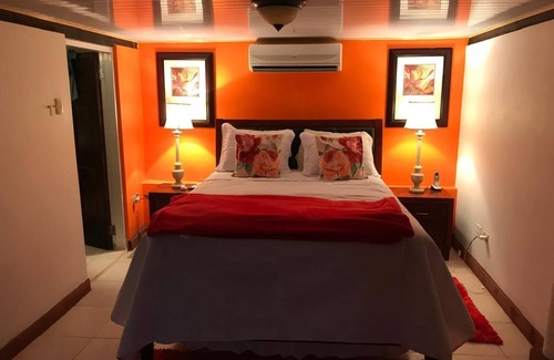 Signal Hill Cabin | Charming SEAVIEW lodge TUCKED IN THE MOUNTAINSIDE of Signal Hill TOBAGO