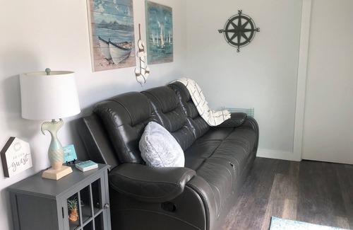 Cookson House | Charming shipping container home with lake view and boat ramp.