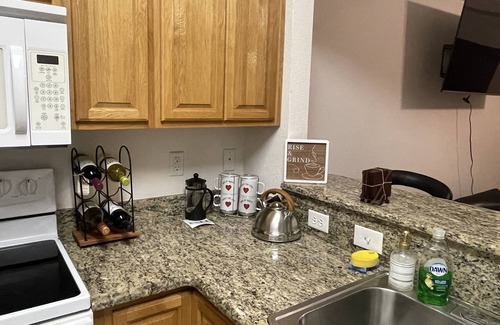 Gainesville Condo | Charming Spanish-style condo nestled in the quiet Royal Park area of Gainesville
