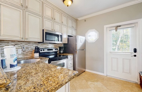 Marathon House | Charming townhome with ocean views, an open porch & steps from the water
