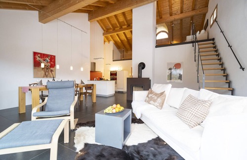 Engadin Scoul Apartment | Chasa Capricornin: modern and spacious attic apartment right next to the Motta Naluns mountain railroad